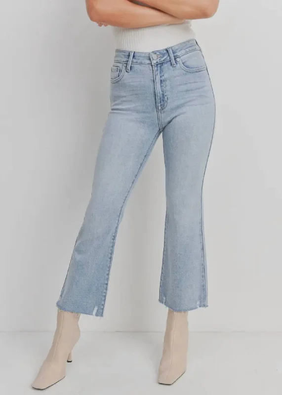 High Rise Crop Flare With Distressed Hem Jean In Light Denim